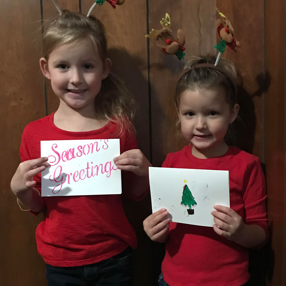 kids with Christmas cards