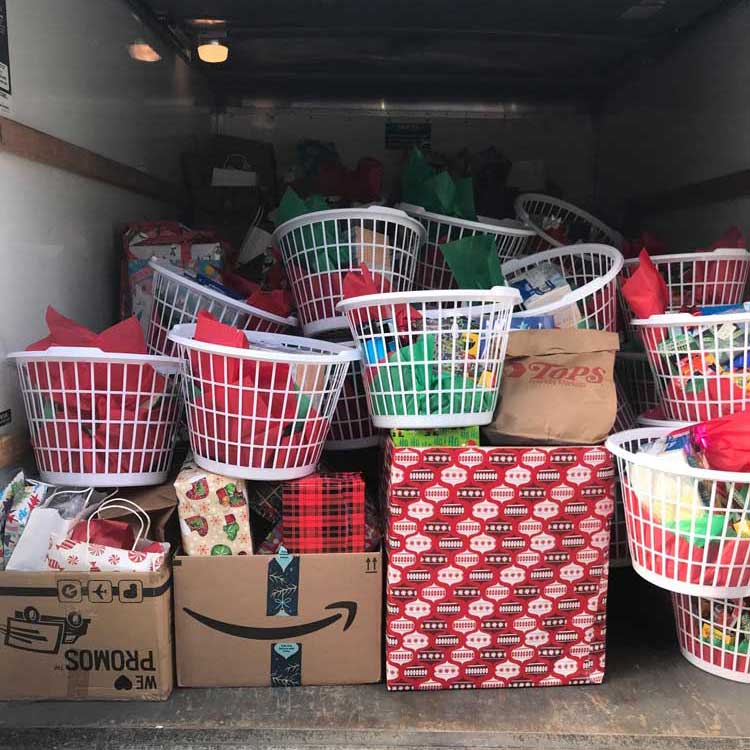 UBMD Orthopaedics & Sports Medicine's Staff Filled a U-Haul With Holiday Gifts and Winter Supplies