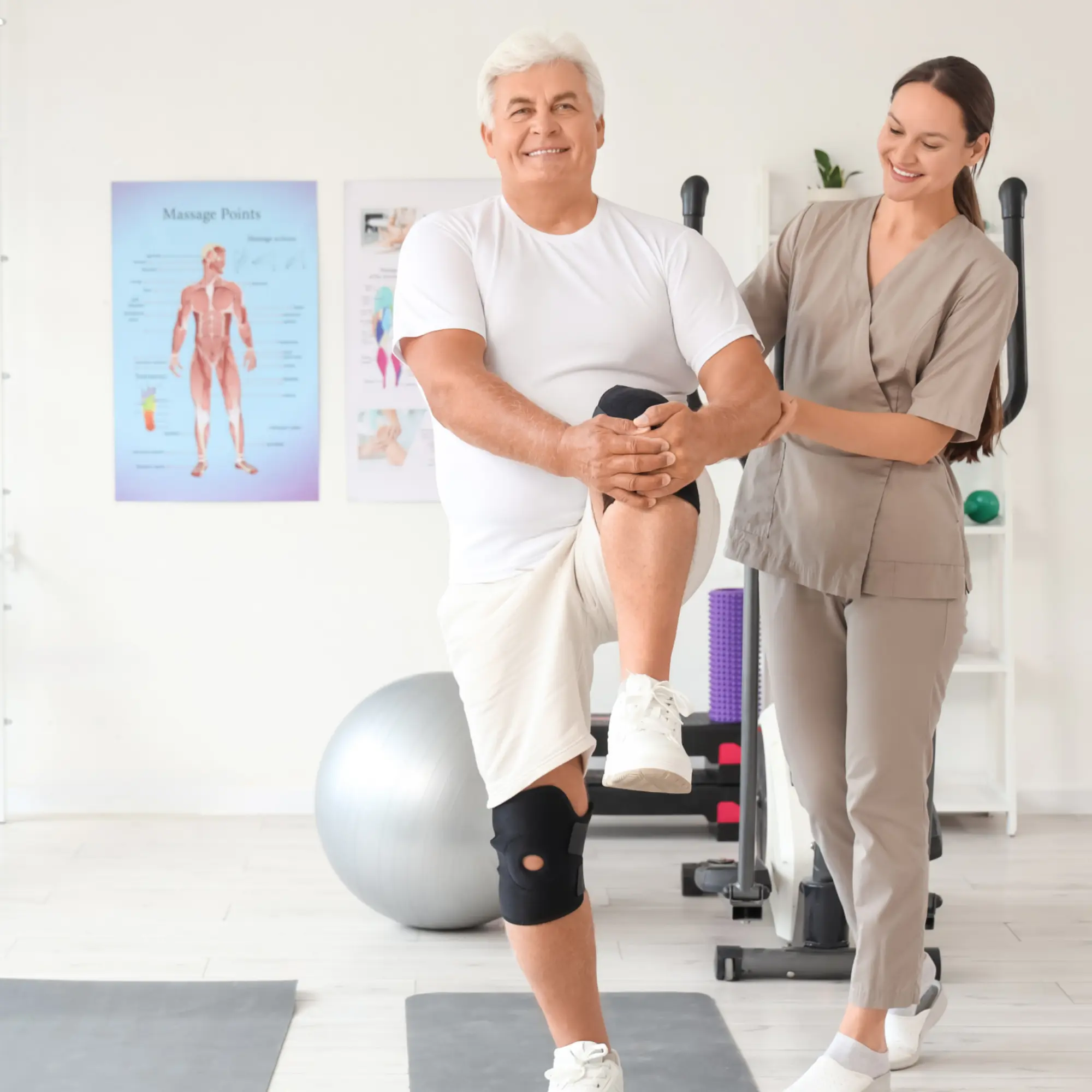 Orthopaedic rehabilitation specialist helping a senior man in a knee brace with a supported stretch in a Lockport, NY therapy clinic